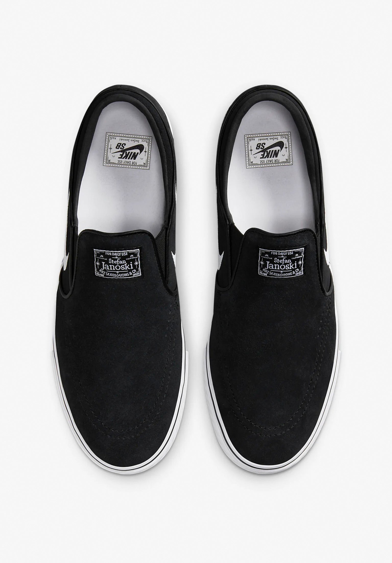 Nike janoski slip on black white best sale